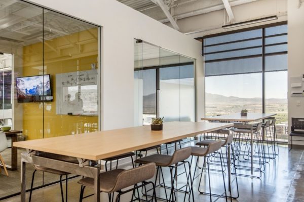 Large communal tables in Lehi Utah office