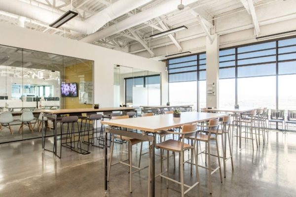 Multiple tables for meetings and collaboration in Lendio office building in Lehi Utah