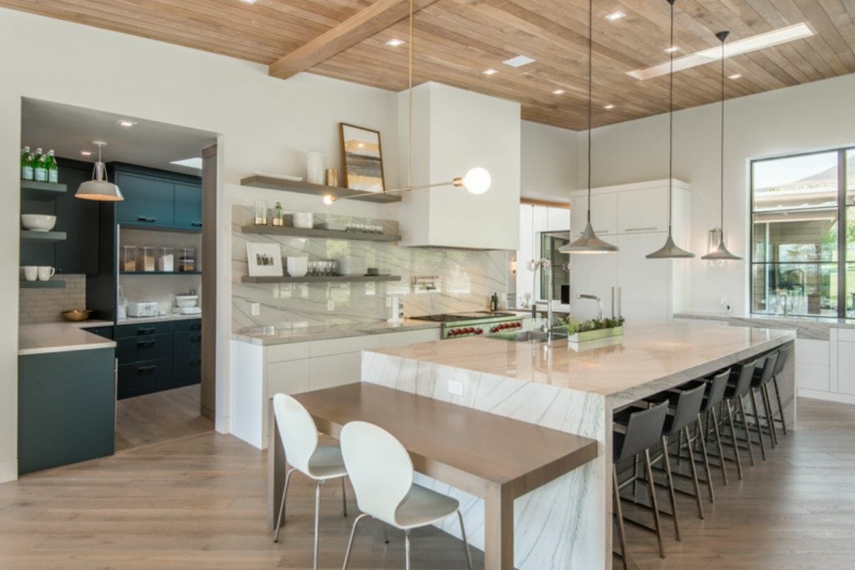 Modern kitchen with waterfall edge island and butler's pantry in Utah home sold by Woodley Real Estate