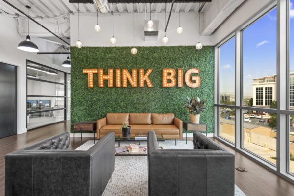Employee Break Area with Modern Chairs and Think Big Sign | Real Estate in Commercial Space