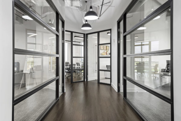 Expansive Windows Look into Offices in Allied Holdings Group Hallway | Real Estate Lehi, UT