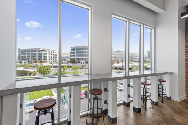 Office Seating & Barstools Overlooking Outdoor View | Woodley Real Estate