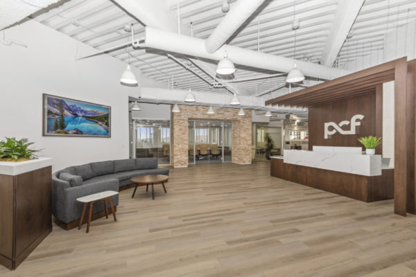 PCF main lobby with front desk and couch | Utah Commercial Real Estate
