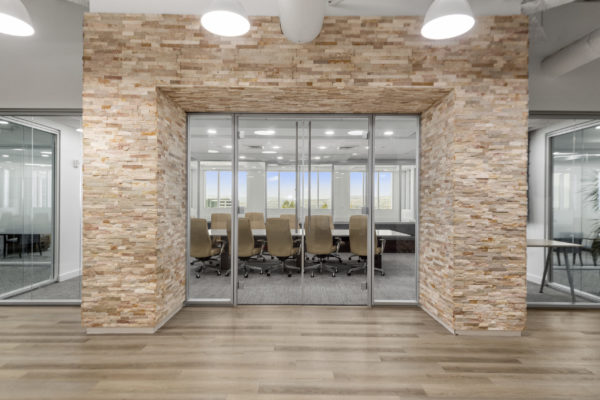 View of conference room with large brick archway framing entrance | Utah Commercial Real Estate