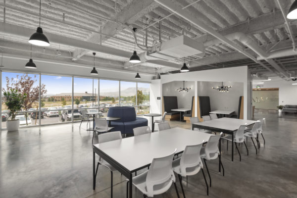 Open office space with a few desks and some seating | Utah Commercial Real Estate