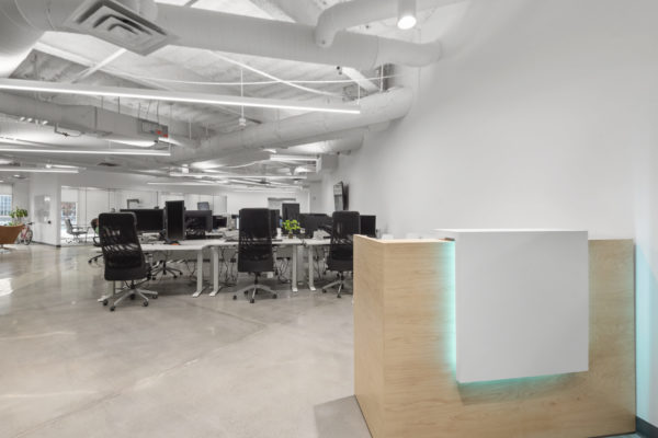 Reception desk with desks and chairs behind it | Utah Commercial Real Estate
