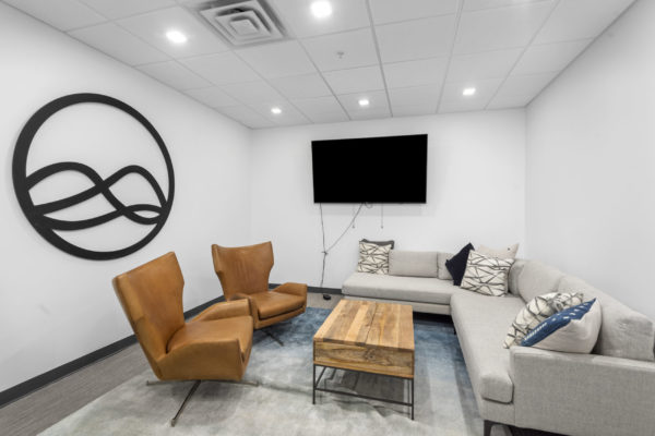Break room with sofa and chairs and tv | Utah Commercial Real Estate