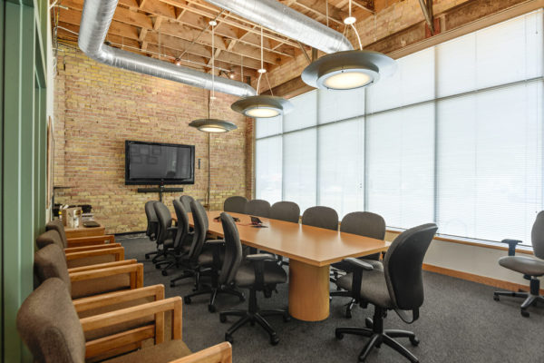 large conference room with one wall made of windows